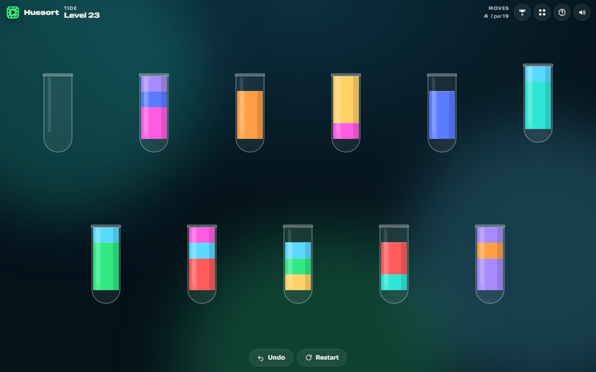 Huesort tubes: glass tubes holding bands of bright colour on a dark purple background, one tube lifted mid-pour